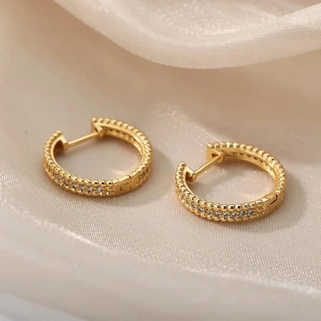 Boucles d'oreilles créoles en cristal clouté